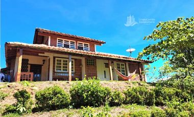 VENDO CASA Y UNA HECTAREA EN GUALACA