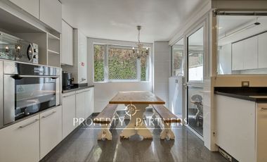 Espectacular departamento con vista panorámica a Santiago, jardín y piscina privada