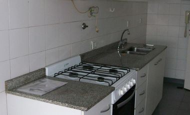 Departamento de dos ambientes con balcón  en torre, pileta y jardín perimetral.