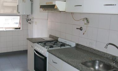 Departamento de dos ambientes con balcón  en torre, pileta y jardín perimetral.