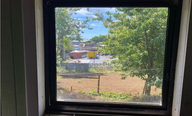 CASA CON AMPLIO TERRENO AL LADO TERMINAL DE BUSES RIO BUENO