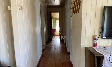 CASA CON AMPLIO TERRENO AL LADO TERMINAL DE BUSES RIO BUENO