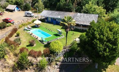 Hermosa parcela con casa y 4 cabañas orilla ruta