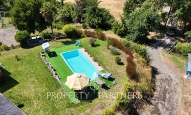 Hermosa parcela con casa y 4 cabañas orilla ruta