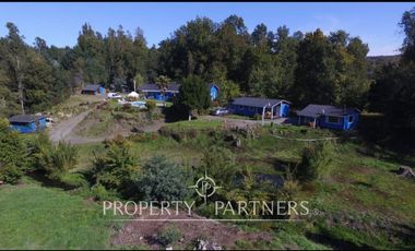 Hermosa parcela con casa y 4 cabañas orilla ruta