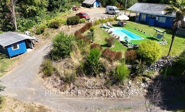 Hermosa parcela con casa y 4 cabañas orilla ruta