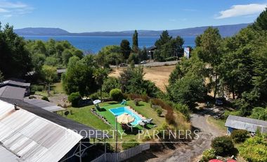 Hermosa parcela con casa y 4 cabañas orilla ruta