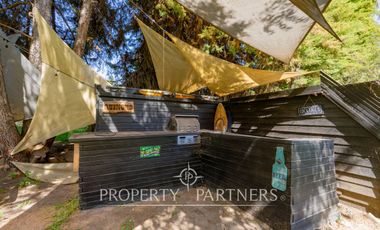 Hermosa Parcela en exclusivo Condominio las Tórtolas, Santa Rita, el mejor sector de Pirque ( Con derecho de canal)