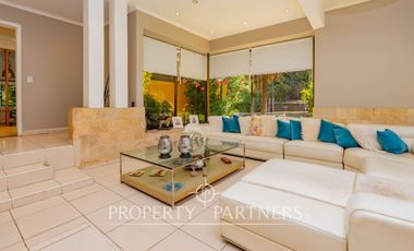 Hermosa Parcela en exclusivo Condominio las Tórtolas, Santa Rita, el mejor sector de Pirque ( Con derecho de canal)