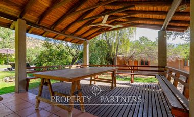 Parcela Llena de Luz y Espacios Abiertos en exclusivo y seguro condominio La Rinconada del Principal, Pirque (con piscina, quincho y un gran jardín)