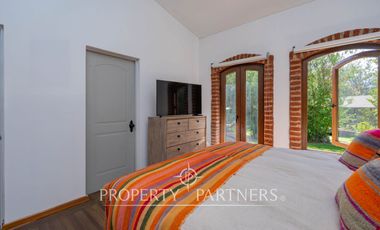 Parcela Llena de Luz y Espacios Abiertos en exclusivo y seguro condominio La Rinconada del Principal, Pirque (con piscina, quincho y un gran jardín)