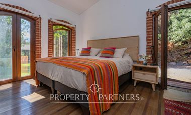 Parcela Llena de Luz y Espacios Abiertos en exclusivo y seguro condominio La Rinconada del Principal, Pirque (con piscina, quincho y un gran jardín)