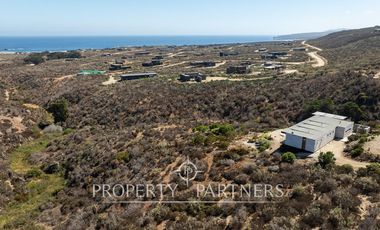 “Vive Frente al Mar en Agua Dulce: Terreno Exclusivo con Vista Inalterable en Huentelauquén”