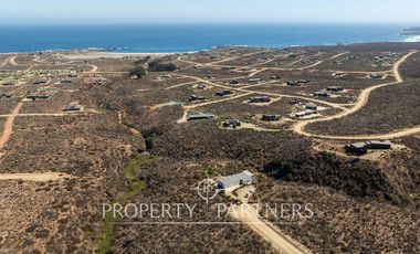 “Vive Frente al Mar en Agua Dulce: Terreno Exclusivo con Vista Inalterable en Huentelauquén”