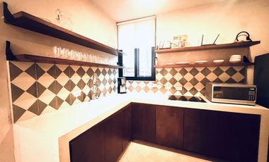 Departamento en venta 1 recamara en planta baja con jardín en Aldea Zama