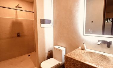 Departamento en venta 1 recamara en planta baja con jardín en Aldea Zama