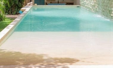 Departamento en venta 1 recamara en planta baja con jardín en Aldea Zama