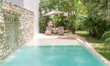 Departamento en venta 1 recamara en planta baja con jardín en Aldea Zama