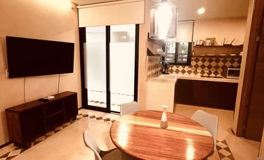 Departamento en venta 1 recamara en planta baja con jardín en Aldea Zama