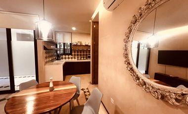 Departamento en venta 1 recamara en planta baja con jardín en Aldea Zama