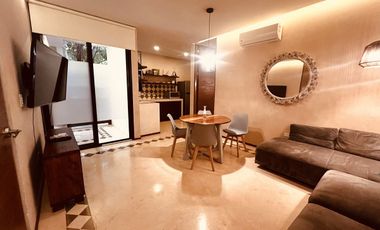 Departamento en venta 1 recamara en planta baja con jardín en Aldea Zama