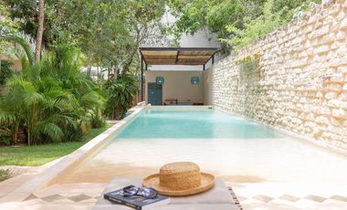 Departamento en venta 1 recamara en planta baja con jardín en Aldea Zama