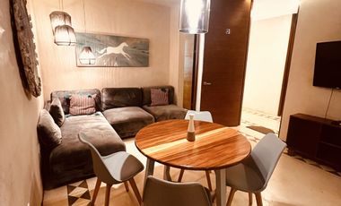 Departamento en venta 1 recamara en planta baja con jardín en Aldea Zama