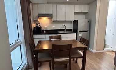 Modern Furnished One Bedroom Corner Condo unit with parking
