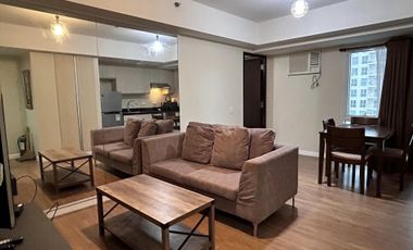 Modern Furnished One Bedroom Corner Condo unit with parking