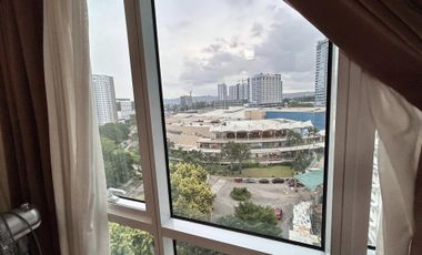 Modern Furnished One Bedroom Corner Condo unit with parking