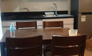 Modern Furnished One Bedroom Corner Condo unit with parking