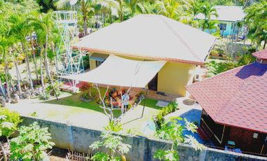 Big land area with house; landscaped grounds; close to beach; development ready