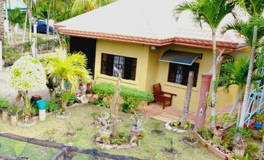 Big land area with house; landscaped grounds; close to beach; development ready