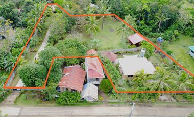 Big land area with house; landscaped grounds; close to beach; development ready