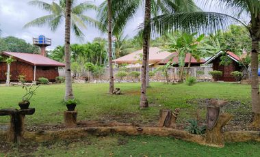 Big land area with house; landscaped grounds; close to beach; development ready