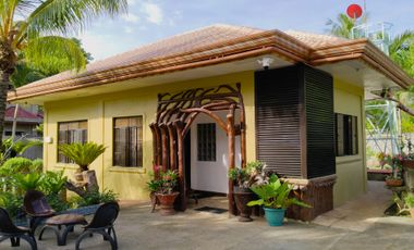 Big land area with house; landscaped grounds; close to beach; development ready