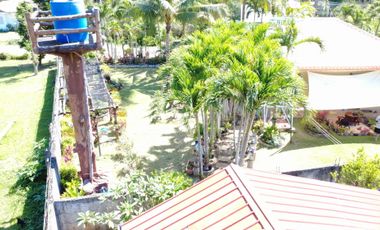 Big land area with house; landscaped grounds; close to beach; development ready