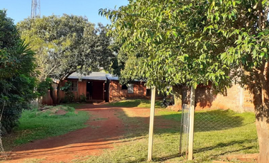 Terreno con casa precaria