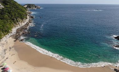 Terreno frete a playa tejon