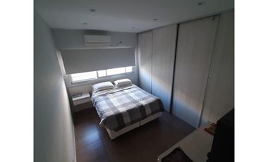 Departamento tipo casa al contrafrente de 4 ambientes con 2 baños, jardin, quincho y parrilla ,