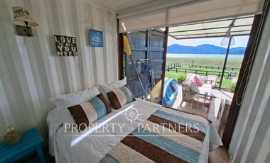 Linda casa con gran vista a orilla de lago