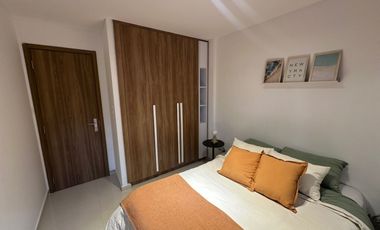 Departamento de 2 dormitorios con patio exclusivo, pileta y parrillero en construcción.
