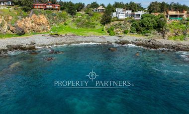 Exclusiva Parcela Frente al Mar con Playa Privada y Bahía Cristalina en Bahía Azul de Los Vilos.