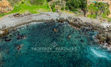 Exclusiva Parcela Frente al Mar con Playa Privada y Bahía Cristalina en Bahía Azul de Los Vilos.