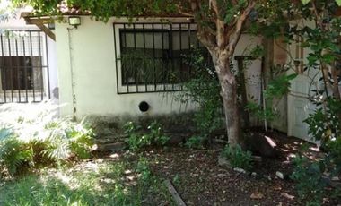 UNA CASA Y DOS DEPARTAMENTOS