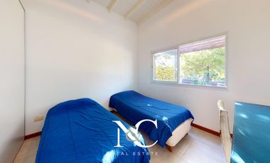 Casa en venta en Costa Esmeralda con fondo libre arbolado