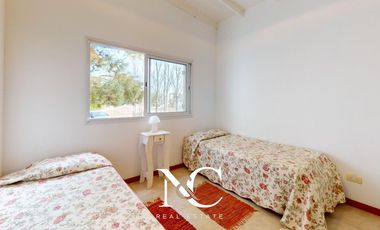Casa en venta en Costa Esmeralda con fondo libre arbolado