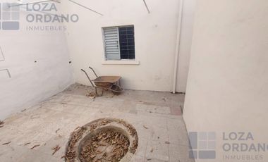 vendo gran terreno con departamento y cocheras