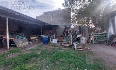 vendo gran terreno con departamento y cocheras