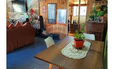 Casa con local comercial